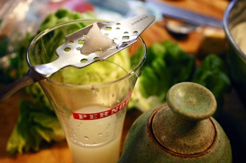 Absinthe louches as ice-cold water is dribbled over the sugar cube.