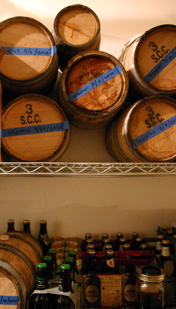 A rack of barreled cocktails.
